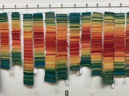 Knit tempestries hanging at the North Kingstown Free Library